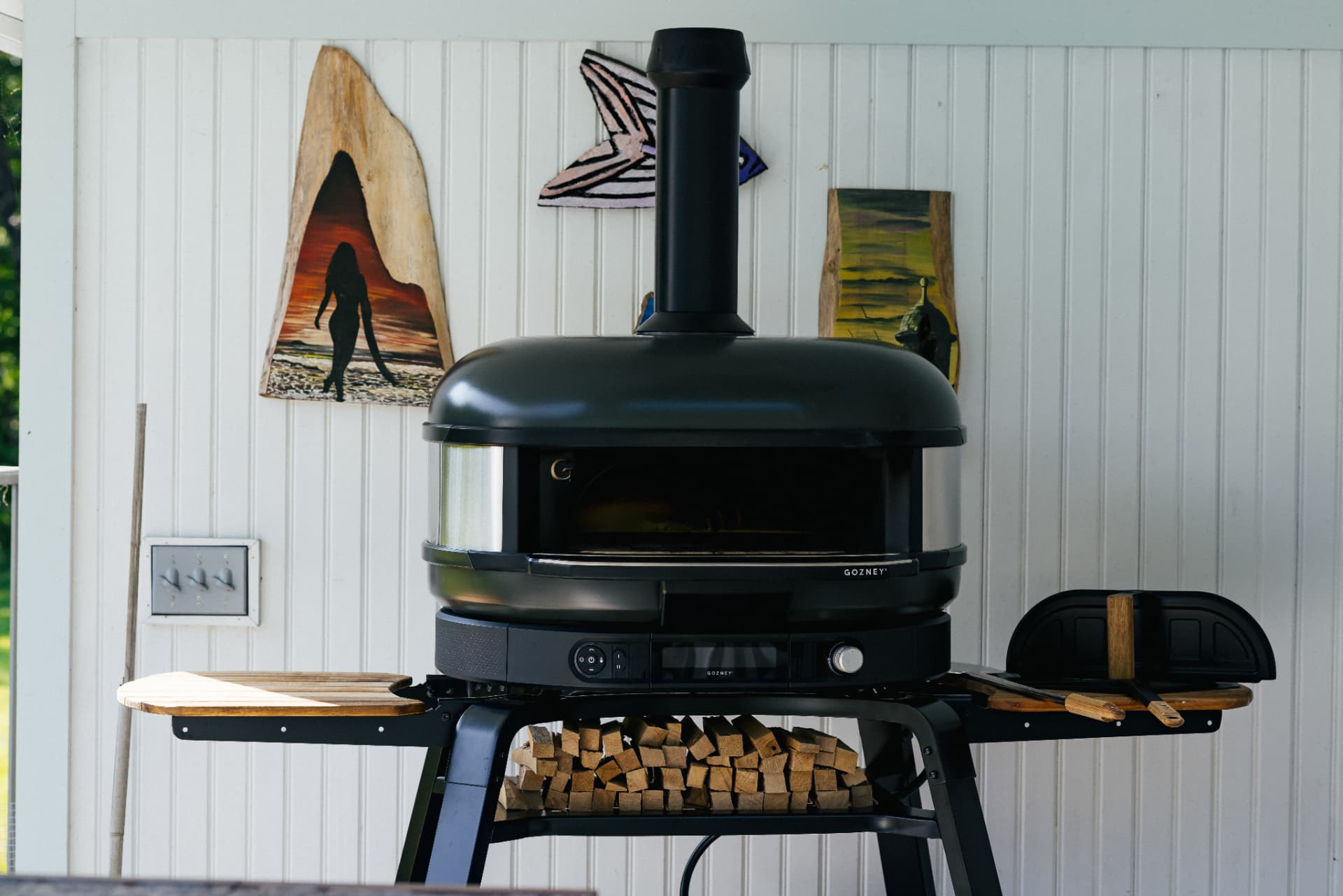 Wood-fired pizza oven on the covered porch