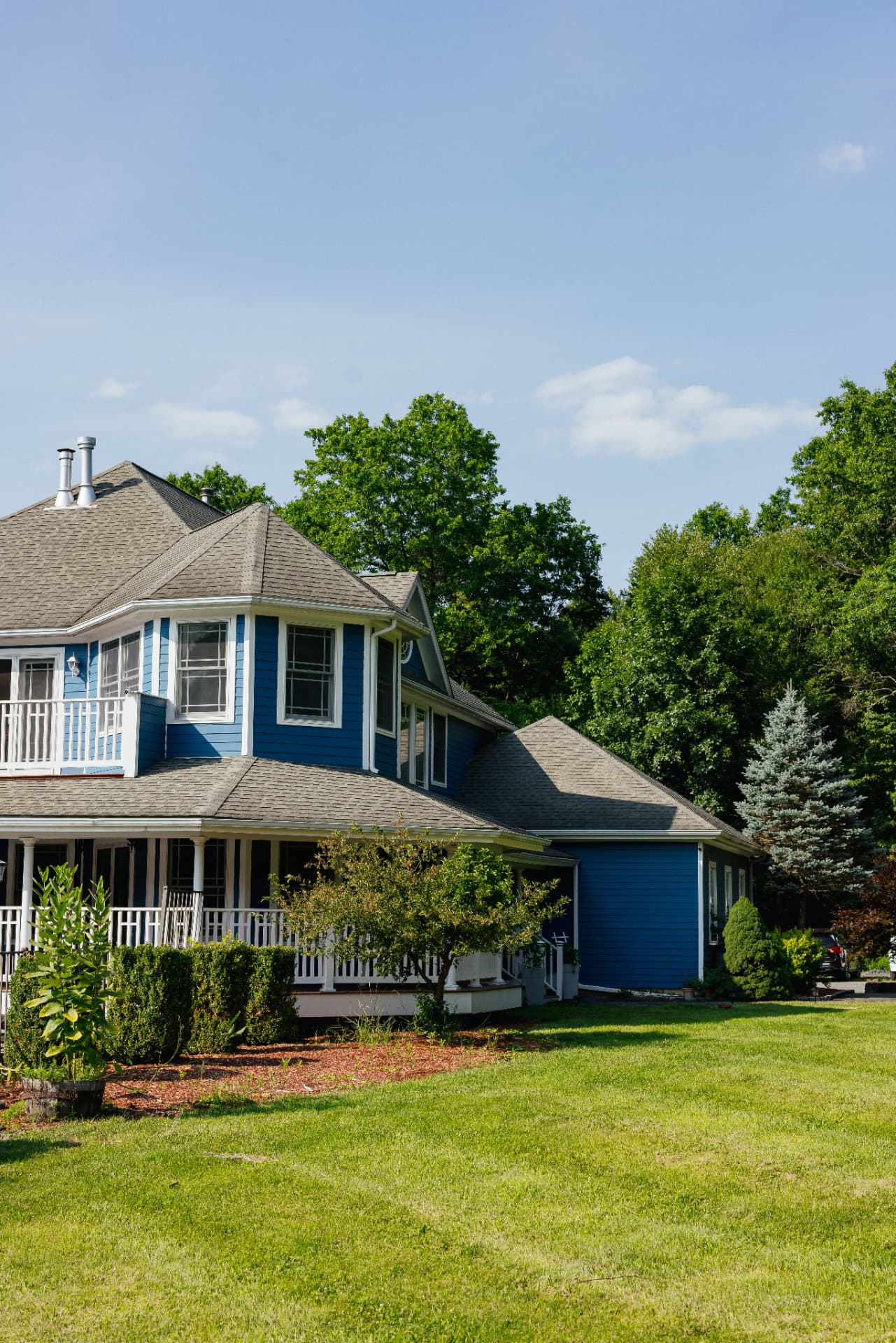 Side view of the house and open lawn