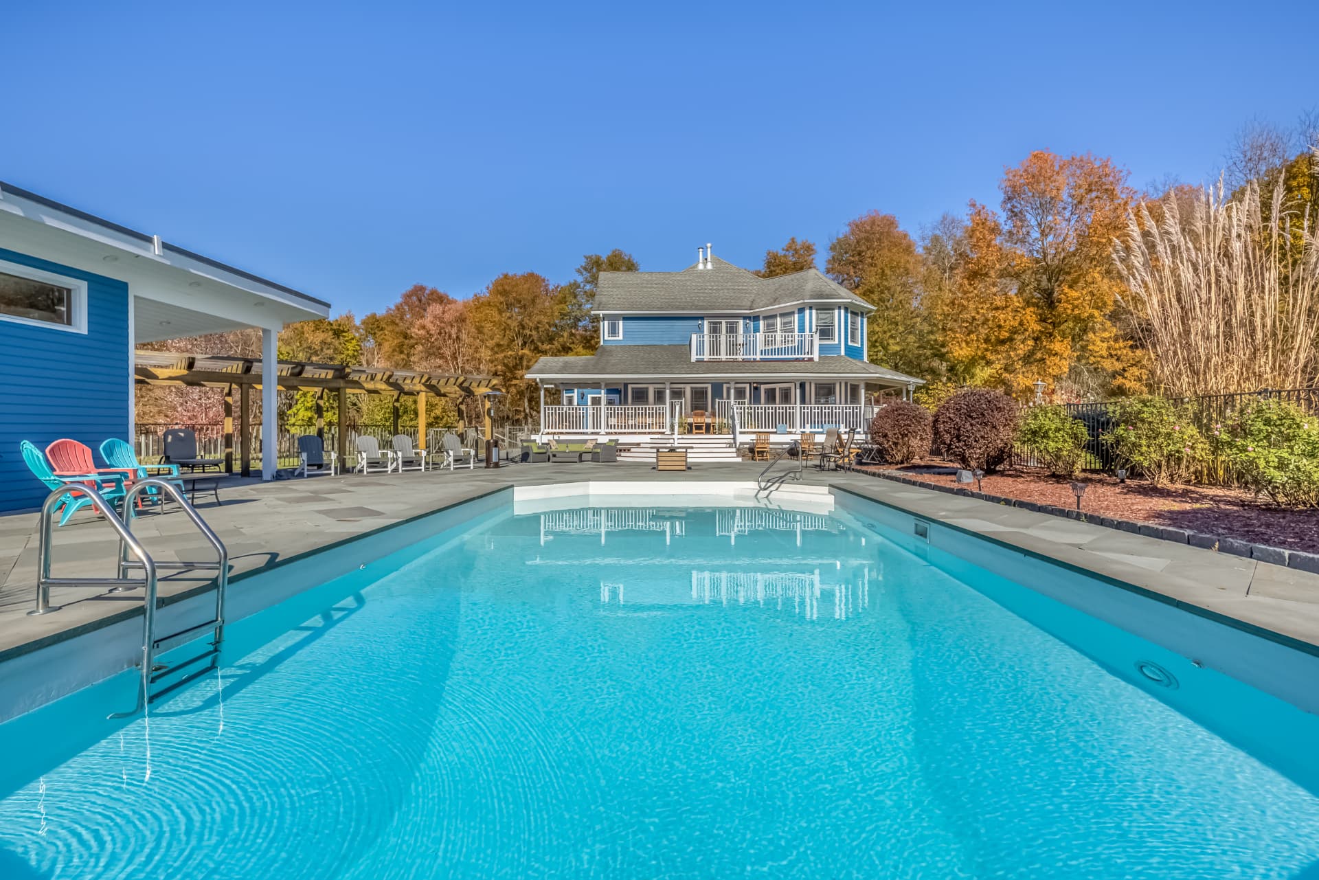 Pool and patio with the estate house behind